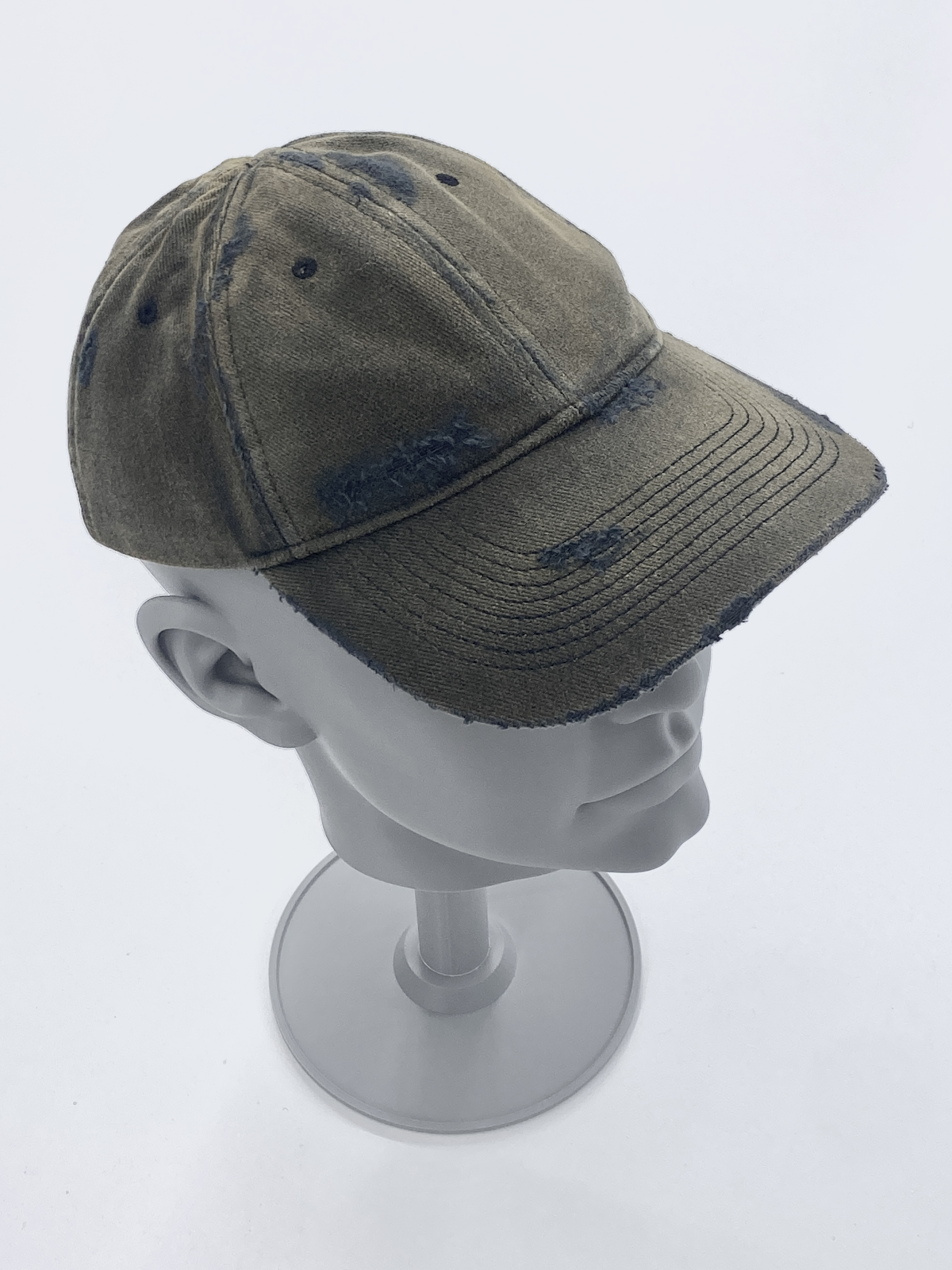 Washed cap sample on a display stand