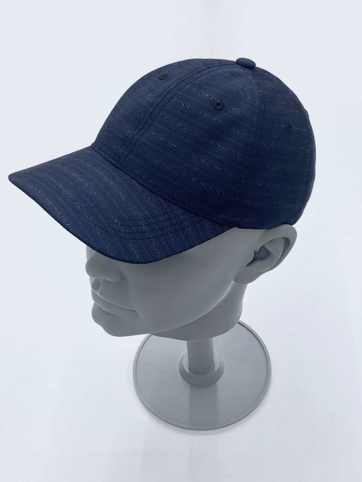 Navy cap sample on a display stand